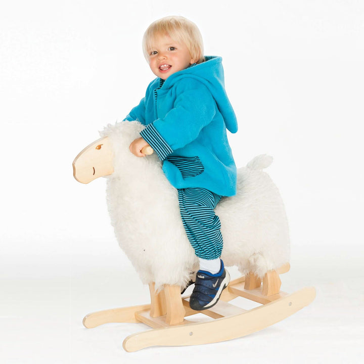 Patternforkids Babyjacke Toretto in leuchtendem Blau mit Zipfelkapuze und gestreiften Bündchen auf einem Schaukelpferd