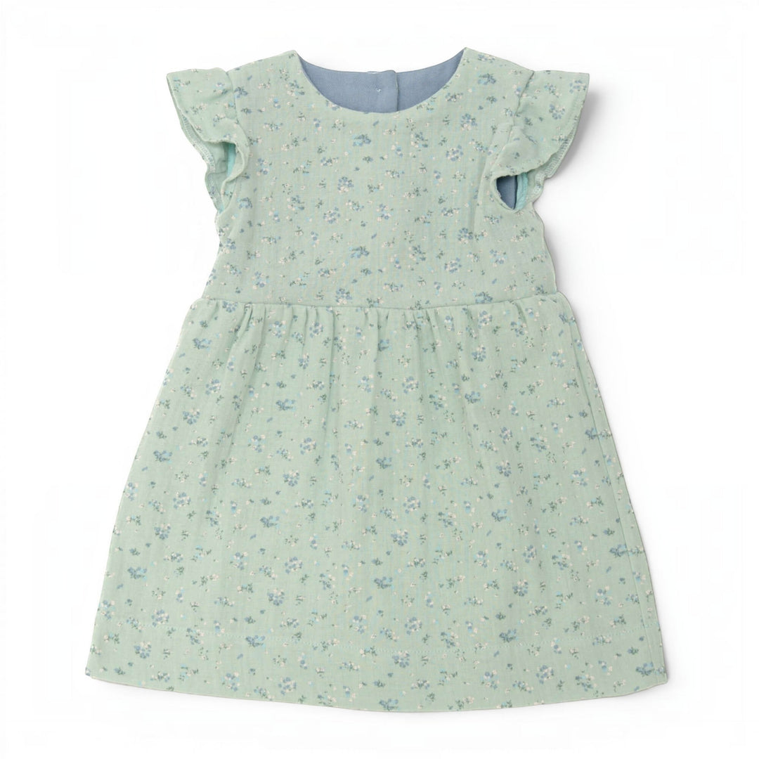Babykleid PDF Schnittmuster ELLA – Retro Kleid mit 2 Varianten 50/56–98/104 in grünem Blumenmuster.