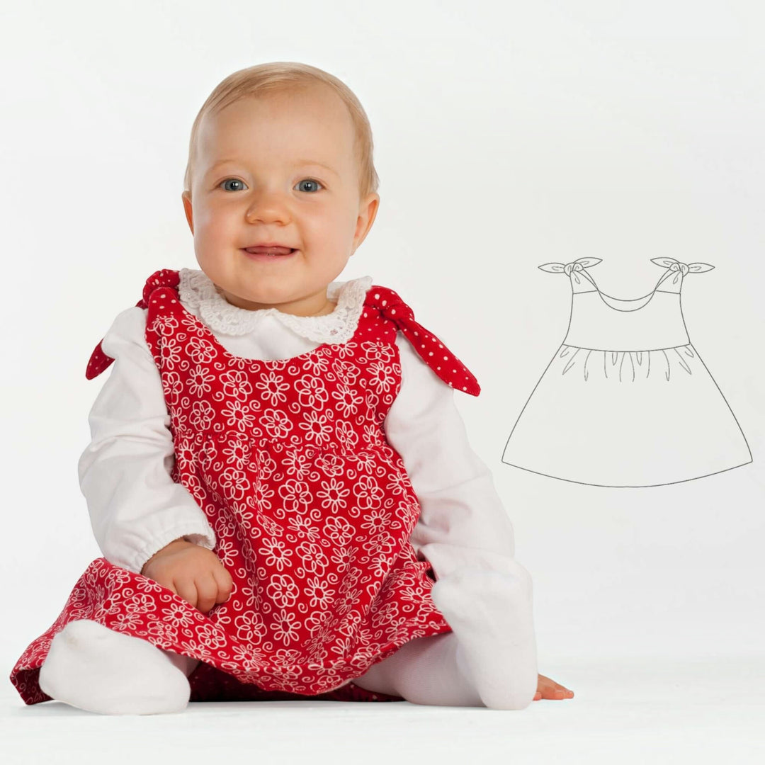 Baby Set PDF Schnittmuster BABY TWINSET – Trägerkleider & Pumphose 50/56–98/104, smiling baby in red dress with flower pattern.