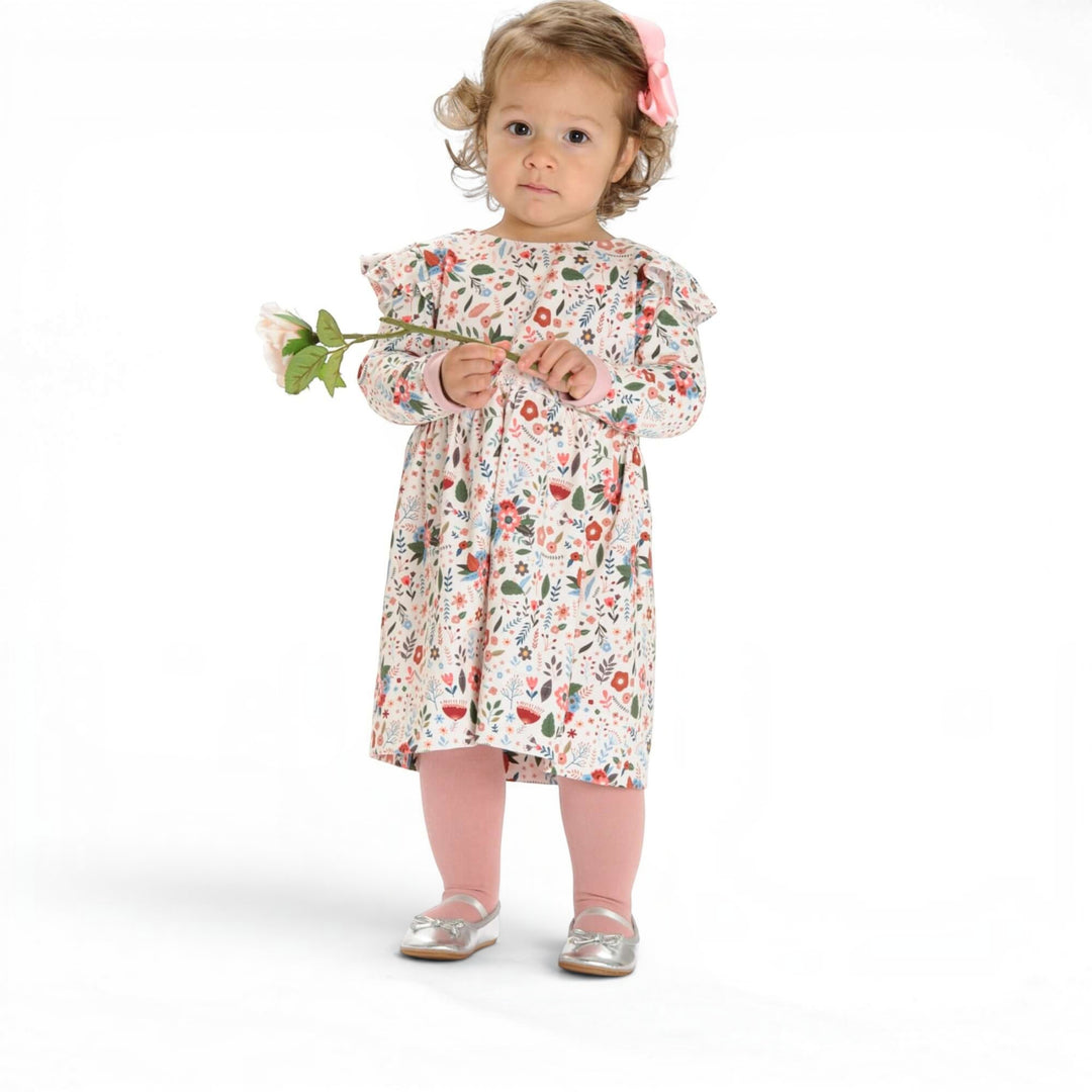Schnittmuster Retro Kleid für Mädchen ELLA PDF, kleines Mädchen im floralen Kleid mit Blume.