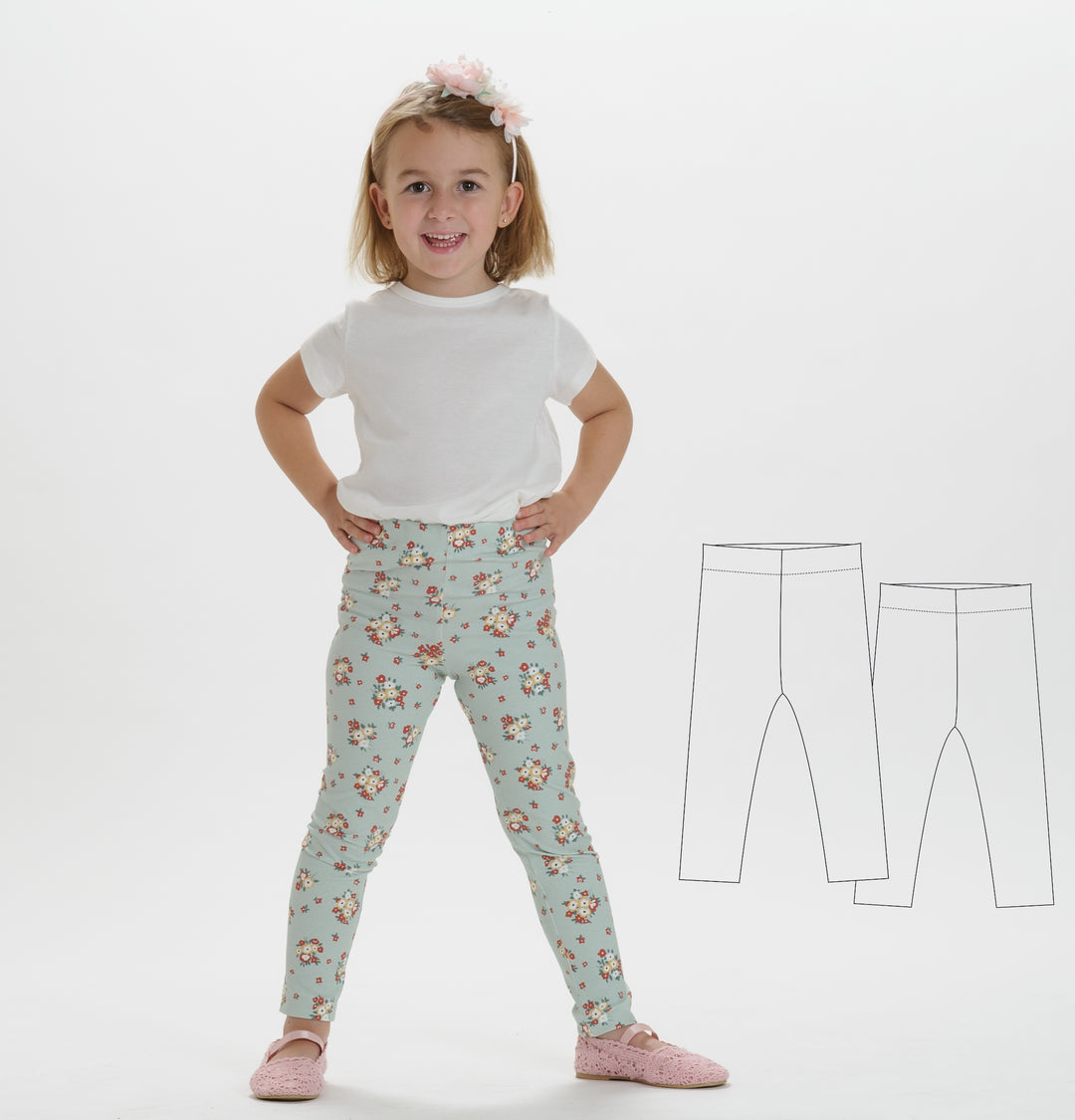 Schnittmuster Baby Kinder Leggings, ein Mädchen trägt farbenfrohe Leggings mit Blumenmuster und weißem Shirt.