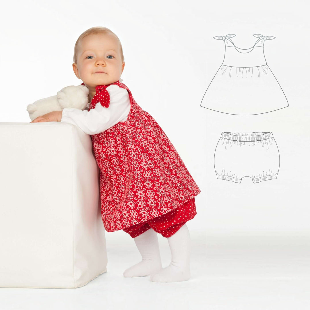 Baby Set PDF Schnittmuster BABY TWINSET – Trägerkleider & Pumphose 50/56–98/104: Baby in red dress with matching shorts.